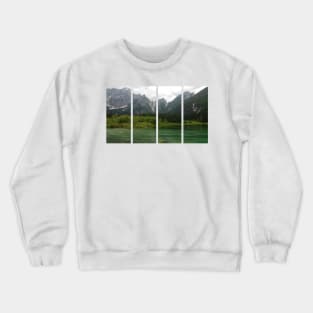 A static shot from the shore of Fusine lake in the Julian Alps with snowy mountains in background. Beautiful nature in a spring cloudy day; no people around Crewneck Sweatshirt
